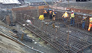 Installation of reinforcement bars around the head of micro-piles